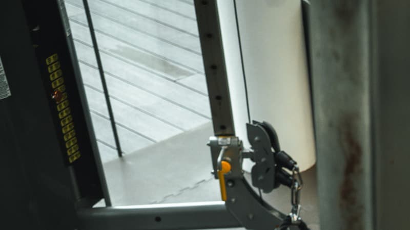 Cable-machine attachment and training equipment inside the Progressive Performance gym.