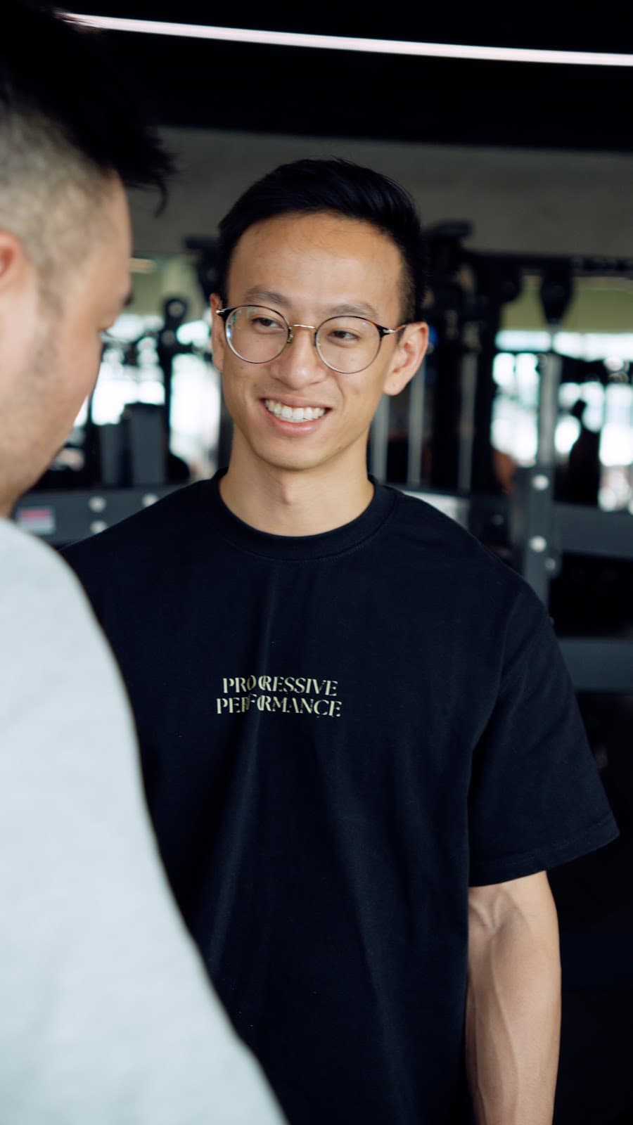 A Progressive Performance coach and client in conversation during a coaching consultation in Singapore.